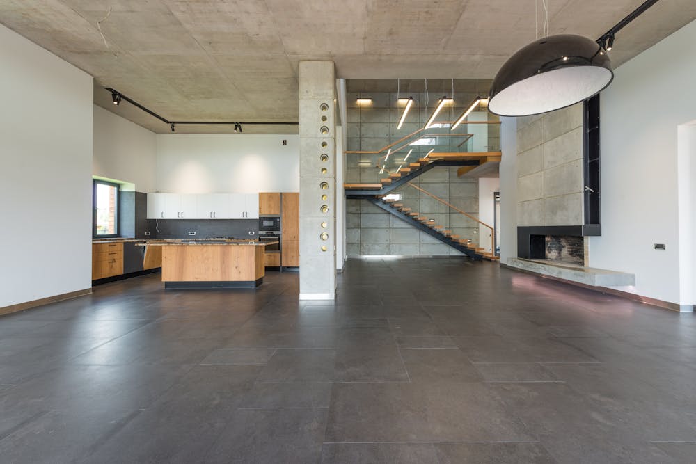 Open-plan interior with high-end decorative concrete flooring
